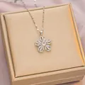 Silver flower pendant necklace with cubic zirconia on a gold gift box background - 6052 Flower Zircon / Silver