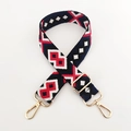 Close-up of geometric jacquard embroidered wide bag strap with gold metal buckles - White Red Dark Blue