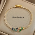 Elegante bracciale dorato con strass colorati a foglia e dettaglio lunghezza 18 cm - Colorato