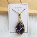 Golden mesh cage necklace with large teardrop purple crystal on a white display card - Gold Amethyst