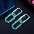Close-up of silver-plated chain link earrings featuring micro-paved green zircon stones - White Gold Green Zirconia