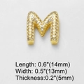 Detail view of gold-plated cubic zirconia letter M pendant with precise size measurements - M