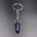 Detail of polished purple hexagonal crystal column pendant with silver metal keychain - Purple Crystal