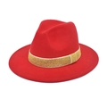 Detail of red fedora hat featuring a gold glitter decorative band on wide brim - Red