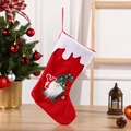 Calcetín de Navidad rojo con gnomo de peluche y letra Y junto a un árbol decorado - Letra Y / Rojo