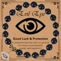 Handmade black beaded Evil Eye bracelet with gold charm on a vintage gift card - Obsidian Bracelet