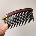 Women's black multi-tooth hair comb with dark red leather finish and gold baby bear tag - Dark Red