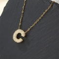 Gold plated letter C pendant necklace with sparkling cubic zirconia on stone surface - Letter C (Pendant Only)
