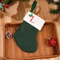 Dark green cable knit Christmas stocking with red embroidered letter L and holly detail - Letter L