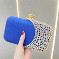 Detailed close-up of royal blue sequin evening clutch with crystal rhinestones and gold clasp - Sapphire Blue