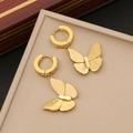 Detail of gold butterfly hoop earrings with cubic zirconias in a beige display box - Earrings (Style 3)