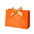 Orange paper gift bag featuring golden rope handles and a matching gold ribbon bow - Orange; Horizontal Extra Small Size 19*15*7 Ribbon Style