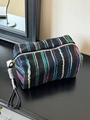 Striped black woven makeup bag with blue, green, and red details and gold zipper - Handheld Black Multi-Color Stripes