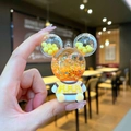 Luminous Mickey-style liquid bear keychain with yellow glitter and striped outfit - Orange