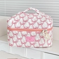 Quilted bow makeup bag with top handle and pink double zippers featuring good night tag - Makeup Bag / Pink