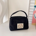 Minimalist black corduroy cosmetic bag featuring a cute brown bear patch and top handle - Black