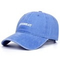 Close-up of blue washed cotton baseball cap featuring COYENRAT 3D embroidery detail - Blue