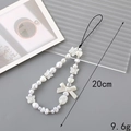 White beaded phone charm with pearls, hearts, and bow accents for bags and keys - Pearl Butterfly Heart Bow (K3288)