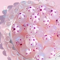 Close-up of 16mm luminous starry painted resin beads with pink floral patterns for DIY jewelry - Pink Flower Purple Dot / 16mm Luminous