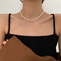 Elegant white freshwater pearl necklace on model with 14K gold filled clasp - Medium Near-round Pearl