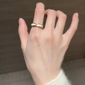 Adjustable golden butterfly ring with wavy band and sparkling crystals on hand - Wave Diamond Ring