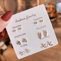 Detail of 6-pair silver earring set with floral and star shapes on a weekly mood display card - E1562-1 7 Pairs Silver Butterfly Flower Style