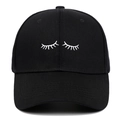 Front view of black cotton baseball cap with white eyelash embroidery in center - Adjustable / Black
