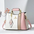 Close-up of tricolor tote with gold handles and butterfly pendant detail on PU leather - White & Pink