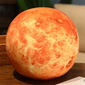 3D Martian planet plush pillow featuring vibrant orange texture on a dark wood table - Keychain 7.5cm / Venus
