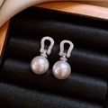 Close-up of elegant pearl drop earrings with silver horseshoe zircon studs in a box - Silver (Silver Pin)