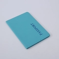 Blue PU leather passport holder case with vertical PASSPORT lettering on gray background - Light Blue