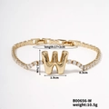 Elegant gold-tone bracelet with zircon-studded W letter pendant and lobster clasp detail - Letter W
