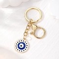 Portachiavi in lega dorata con ciondolo occhio blu per accessori per borse - Occhio Strass Bianco Blu