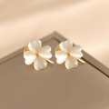 Golden clover brooch pin with opal-style cream petals on elegant champagne satin fabric - Double Clover Set