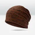 Brown knit beanie featuring all-over black script print and soft elastic fabric - All-over Script Print Style / Coffee