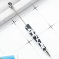 Silver beadable stylus pen with black and white cow print pattern on a white grid - Black White Cow Print Stylus (85)