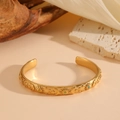 Golden celestial open bangle featuring embossed sun moon and star motifs with colored stones - Sun Moon Star Embossed Colored Zirconia Style / Gold (Colored Zirconia)