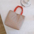 Dettaglio della borsa tote in tela floreale con manici arancioni e chiusura magnetica - Piccoli Fiori Rossi