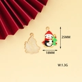 Detail of penguin Christmas charm with enamel finish and gold metal back size 25mm - Ringing Christmas Penguin