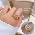 Detail of gold-plated ring with a round pink center stone and sparkling clear zircons - Square Pink Rhinestone Open Ring (J0074) / Gold - Ring (J0074)