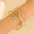 Set of 7 gold stackable bracelets featuring smooth bands and zircon inlaid textures - Gold Thin Rhinestone Rhombus 7-Piece Set (DZ-561)