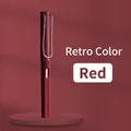 Vintage matte red inkless pen with metallic clip on a matching circular display stand - Small Rod HB / Retro Red