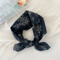 Navy blue linen square scarf with white floral patterns tied in a stylish knot - Line Flower Black
