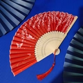 Classic red bamboo folding fan featuring cherry blossom patterns and a matching tassel - Red Cherry Butterfly