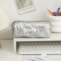Detail of silver quilted butterfly pencil case with metallic texture and woven label - 20*7*8cm / Silver Bowknot