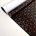 Self-adhesive black gift wrap with rose gold geometric hexagon pattern in a roll - Bronzing Diamond