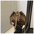 Detail of leopard print bucket bag with drawstring closure and gold chain strap - Brown