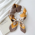 Yellow and brown floral satin silk square scarf styled in a knotted elegant layout - Round Deer Leaf