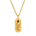 Macro shot of gold Taurus zodiac necklace pendant with bull silhouette and date engraving - Taurus