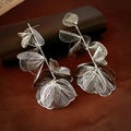 Macro detail of intricate silver woven mesh flower petals and long tassel earrings - Silver (S925 Silver Needle)